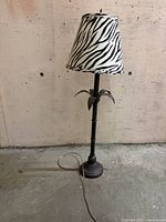 Full view of lamp showing height, base, and zebra shade