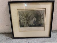 Front view of framed print showing image, mat and black frame