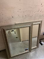 Front view showing both matching mirrors and ornate frames