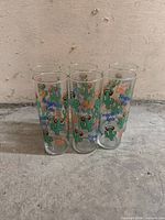 Front view of six Seagram's Gin cactus highball glasses standing together