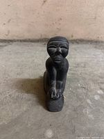 Front view of soapstone kneeling figure