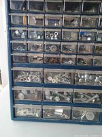close-up of drawers showing assorted bolts, nuts, screws, washers