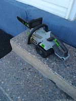 Ego chainsaw side profile on step