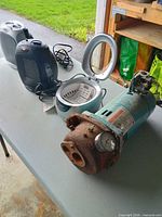 Two heaters, ultrasonic cleaner open, water pump foreground