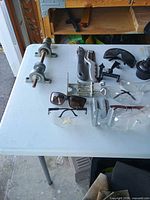 Overview showing shaft assembly, utility knife, eyewear, metal brackets