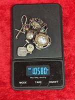 All sterling silver items on scale showing 1.05 oz weight