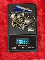 Lot on digital scale showing 1.068 oz