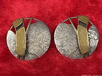 Front view of both earrings displaying design and mixed metals