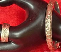 Ring and bracelet on display hand showing patterns and color