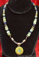 Front view of sterling silver and gemstone bead necklace on bust
