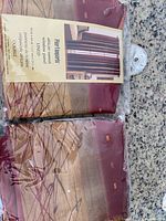 Front view of two packaged African Sunset window panels