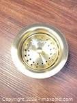 Top view of assembled brushed brass basket strainer