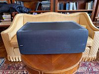 Front angled view of speaker on table