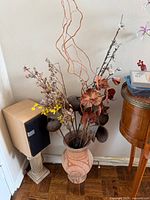 Full view of ceramic vase with faux floral arrangement