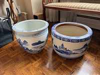 Both ceramic planters side by side