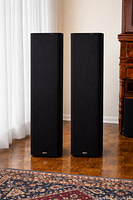 Pair of black-grille B&W DM603 S3 tower speakers side by side