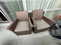 Both wicker armchairs top view showing cushions