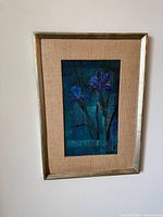 Full view of framed floral painting on wall