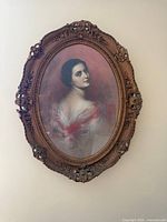 Front view of framed portrait showing subject and frame details