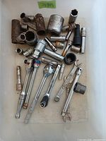 Top view of entire lot showing sockets, ratchets and extensions in bin