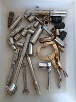Top view of entire lot showing sockets, ratchets, extensions, wrench, locking pliers