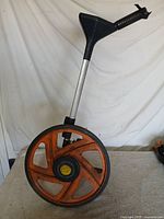 Full view of DigiRoller Plus II showing wheel, handle and control panel