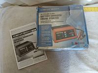 Retail box and user manual for Cen-Tech 60653 charger