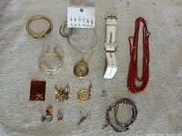 Entire lot laid out on fabric showing all jewelry pieces