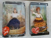 Both dolls in original boxes front view