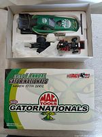Open box showing diecast body and chassis inside styrofoam insert