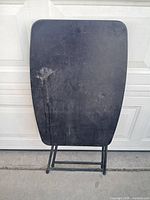 table folded flat against garage door