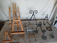 Mixed lot showing all easels, plate stands and doll stands