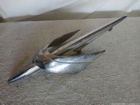 Top view of Pontiac Jet Plane hood ornament showing overall form and chrome finish