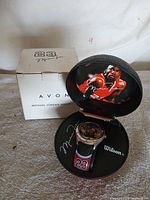 Watch, basketball display case open, outer box visible