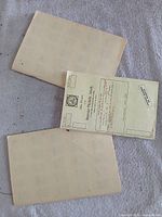 Three cream APS Sales Division circuit books on a surface