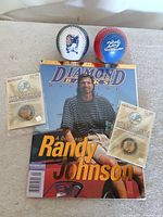 Lot overview showing magazine, two baseballs, two medallions