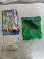 Two sealed toy bags side by side