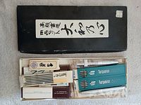 Full lot showing drafting leads and calligraphy kit inside presentation box
