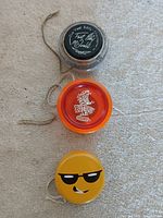 Three yo-yos arranged vertically