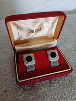 Cufflinks in open red velvet Swank box, overall view