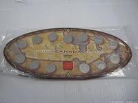 Front view showing full oval display with twelve coins
