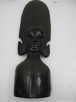 full view of ebony wood African bust with elongated headdress