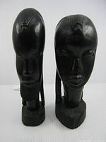 Front view of both ebony head busts
