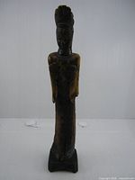 Full frontal view of entire figurine on base