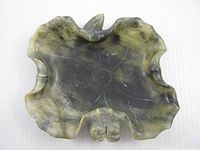 Top view showing full lotus leaf shape, veining and attached lotus elements