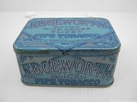 Top view of blue Edgeworth tobacco tin showing full graphics