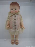 Front view of Effanbee Patsy doll showing outfit and bracelet