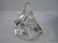 Front view of clear crystal iceberg paperweight showing both penguin figures