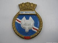 Front view of cast metal HMCS Qu'Appelle crest showing full design and colors