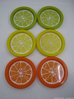 Six coasters laid out in three color pairs